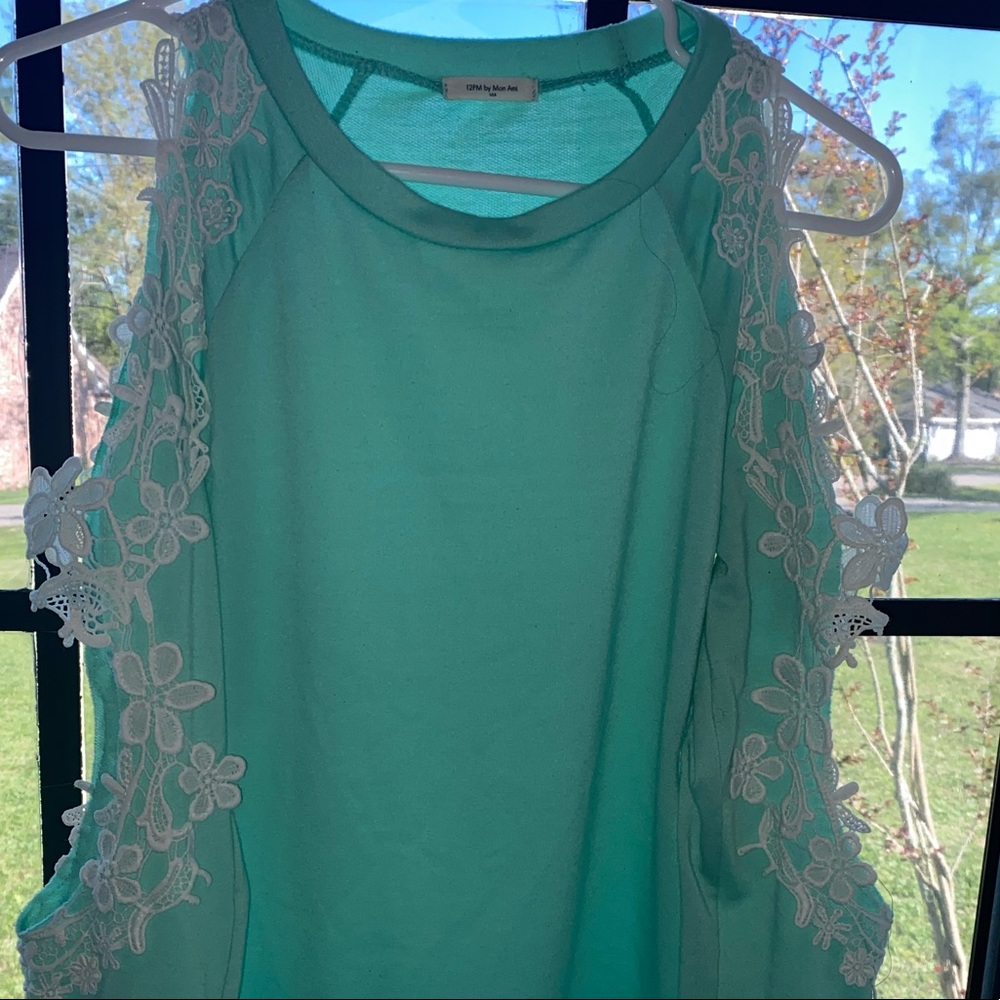 A long sleeve baby blue long sleeve blouse.